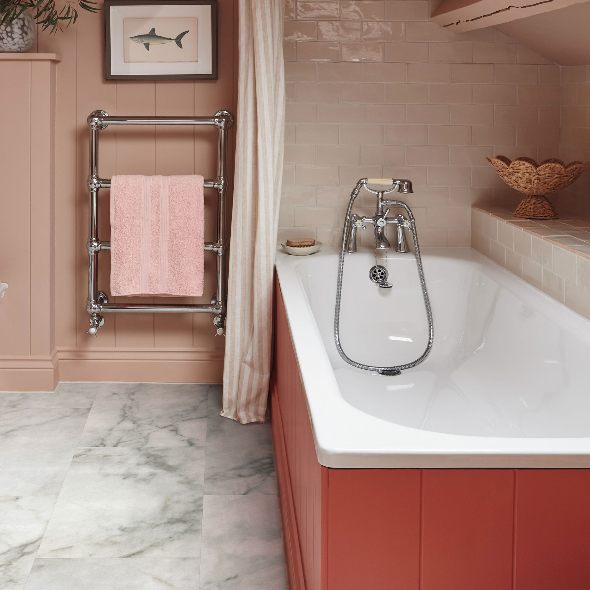 Bathroom with marble LVT flooring, coral panelled bath and pink panelled walls