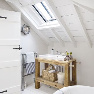 bathroom with wooden table and white flooring