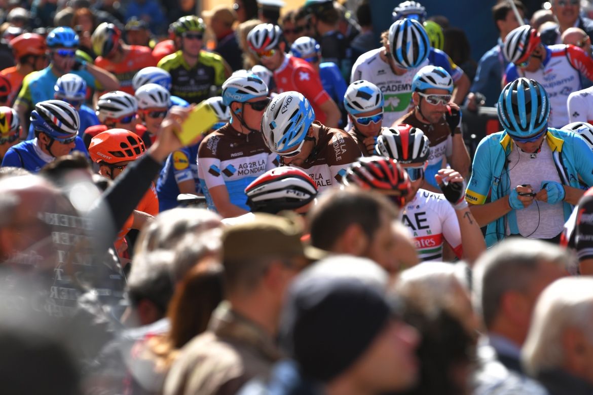 The riders line-up for the start