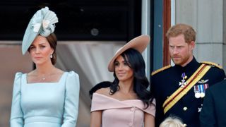 Catherine, Duchess of Cambridge, Meghan, Duchess of Sussex, Prince Harry, Duke of Sussex and Isla Phillips stand on the balcony of Buckingham Palace