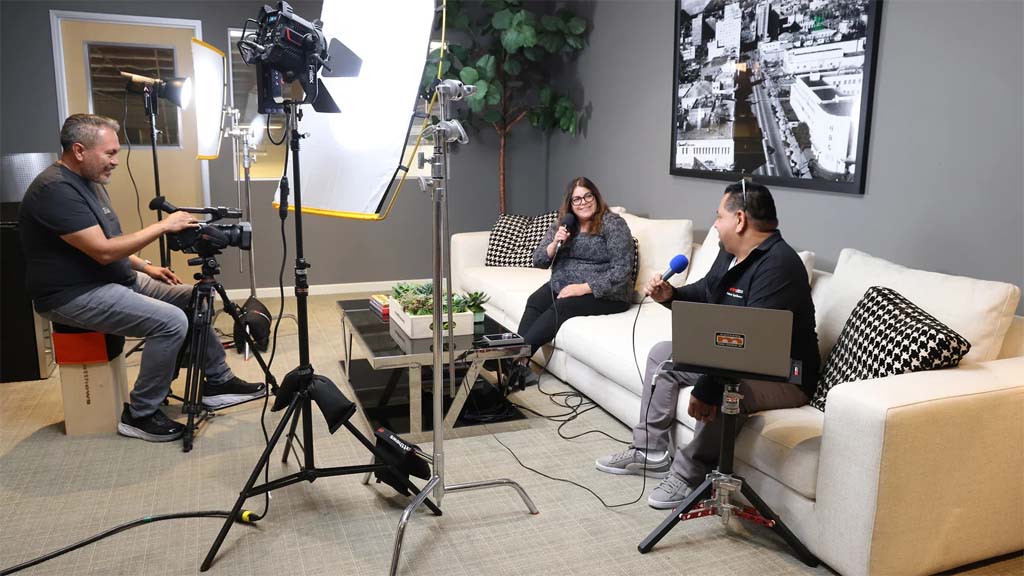 Content creators using the 40-inch Sliding Leg C-Stand from Matthews Studio Equipment 