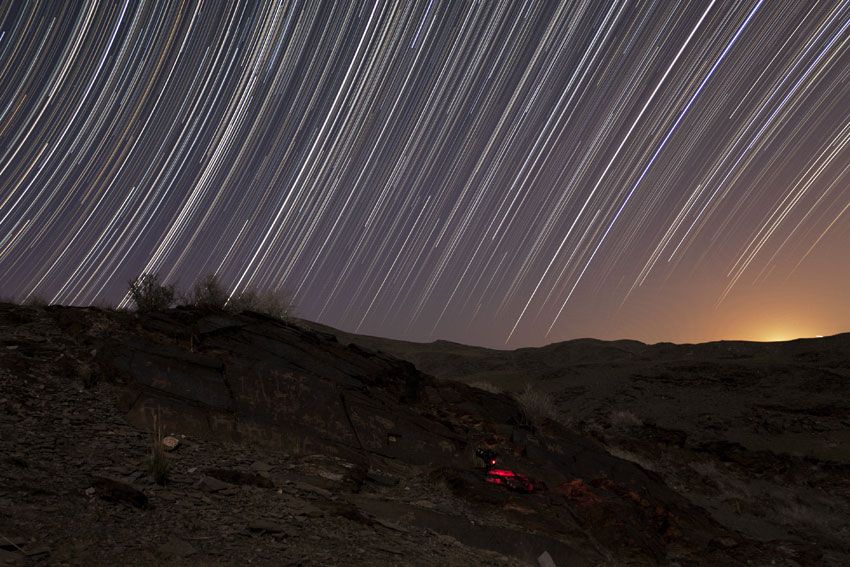 Star Trails Arc Over Ancient Landscape in Photo | Space