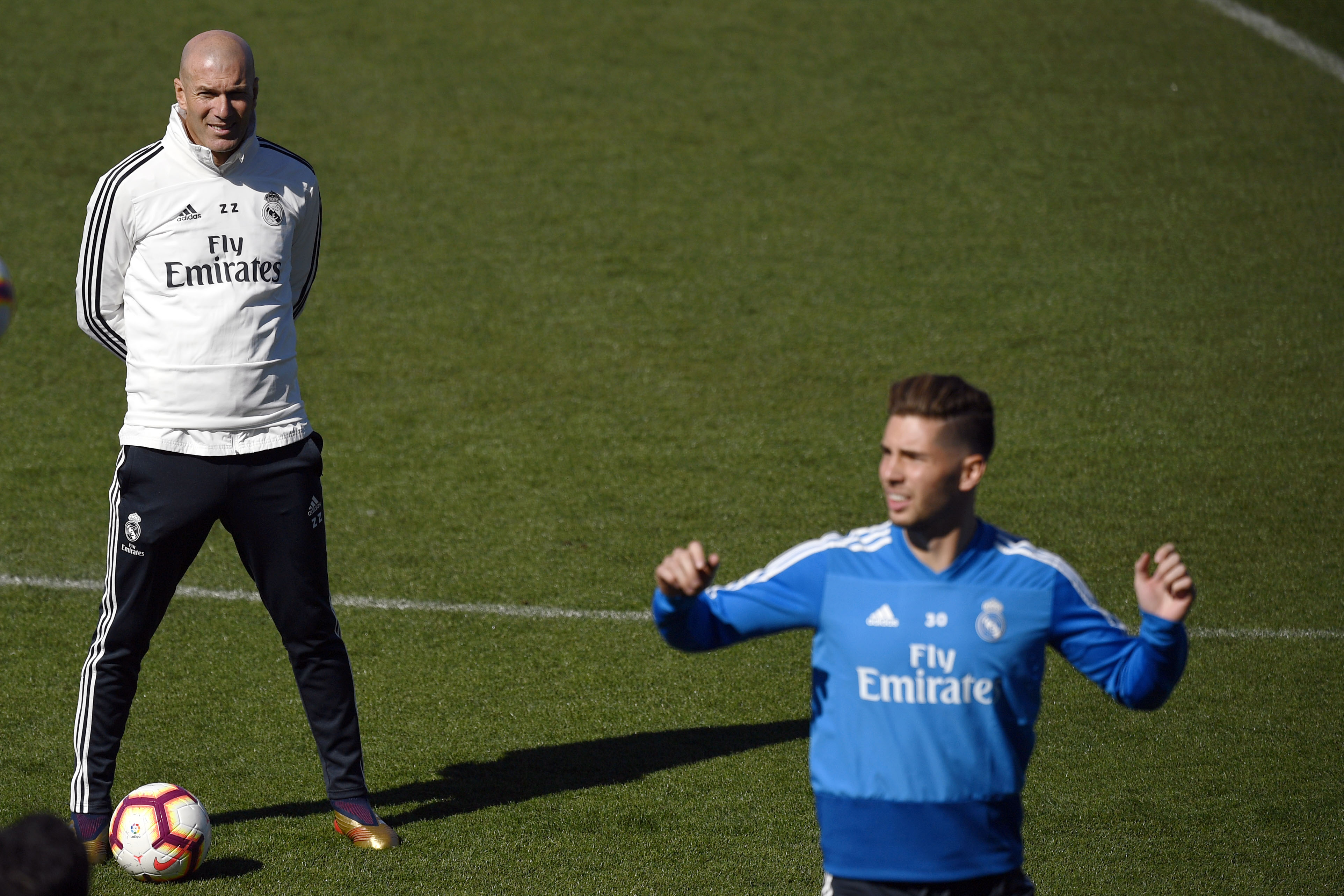 Real Madrid coach Zinedine Zidane watches his son Luca during a training session in March 2019.