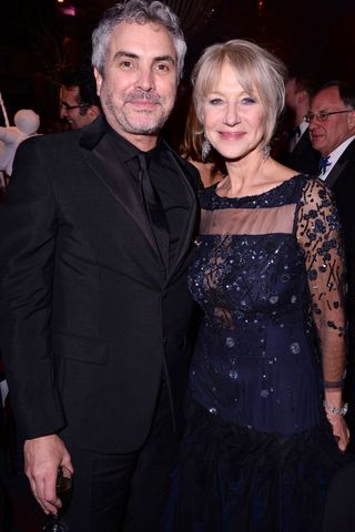 Alfonso Cuaron and Helen Mirren at the BAFTAs 2014