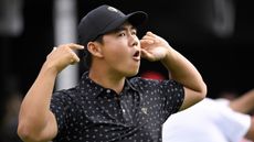 Tom Kim gestures to the crowd in Montreal at the Presidents Cup