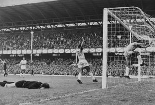 Alcindo (arms raised) and Jairzinho celebrate Garrincha's goal for Brazil against Bulgaria at Goodison Park in the 1966 World Cup.