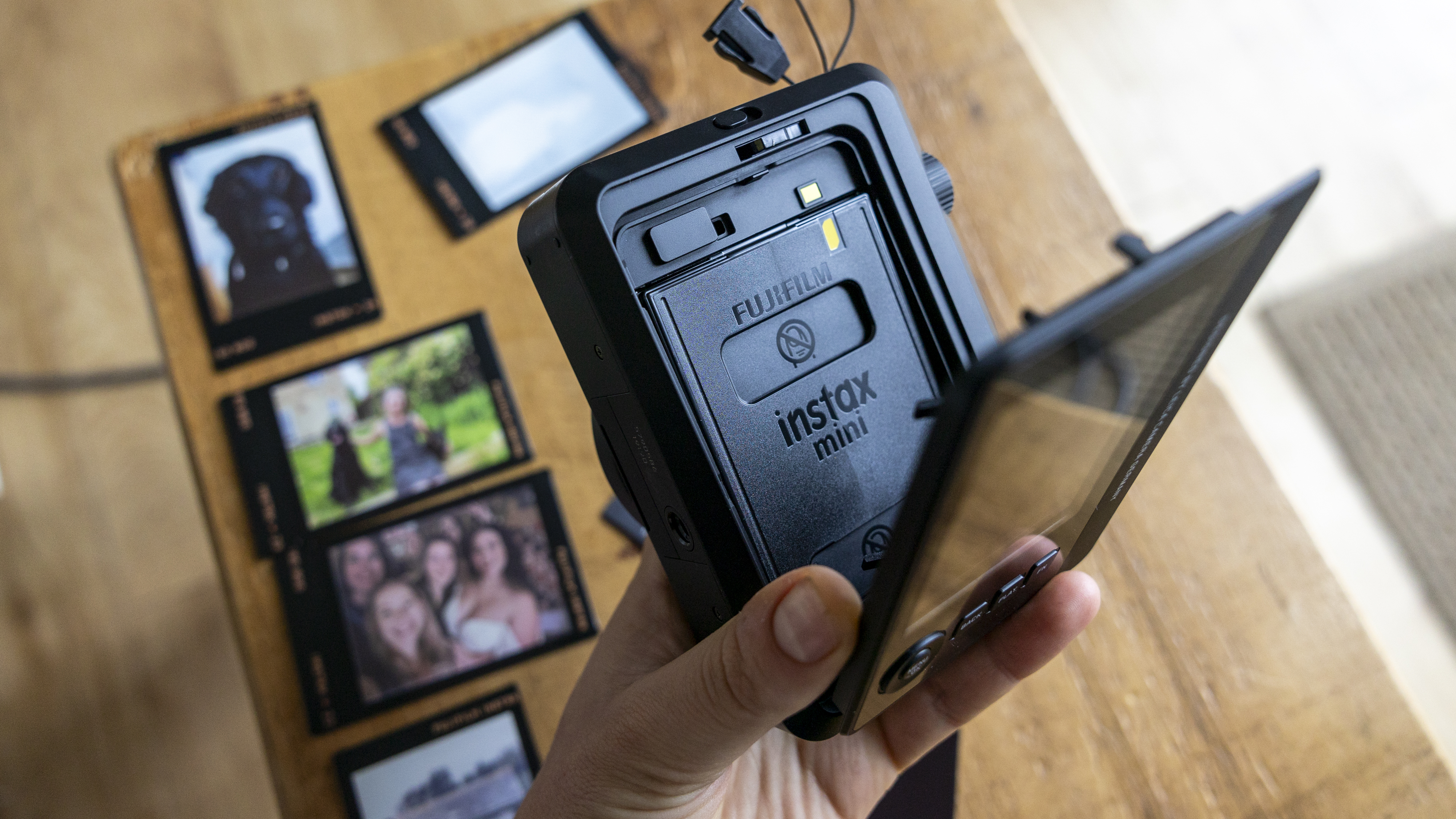 Fujifilm Instax Mini film being loaded into the Leica Sofort 2