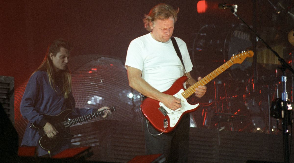 Scott Page (left) and David Gilmour of Pink Floyd perform on stage at Wembley Stadium on the &#039;A Momentary Lapse of Reason&#039; tour, on August 5, 1988 in London