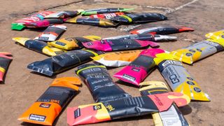 A collection of the best energy gels for cycling sprawled out on the floor