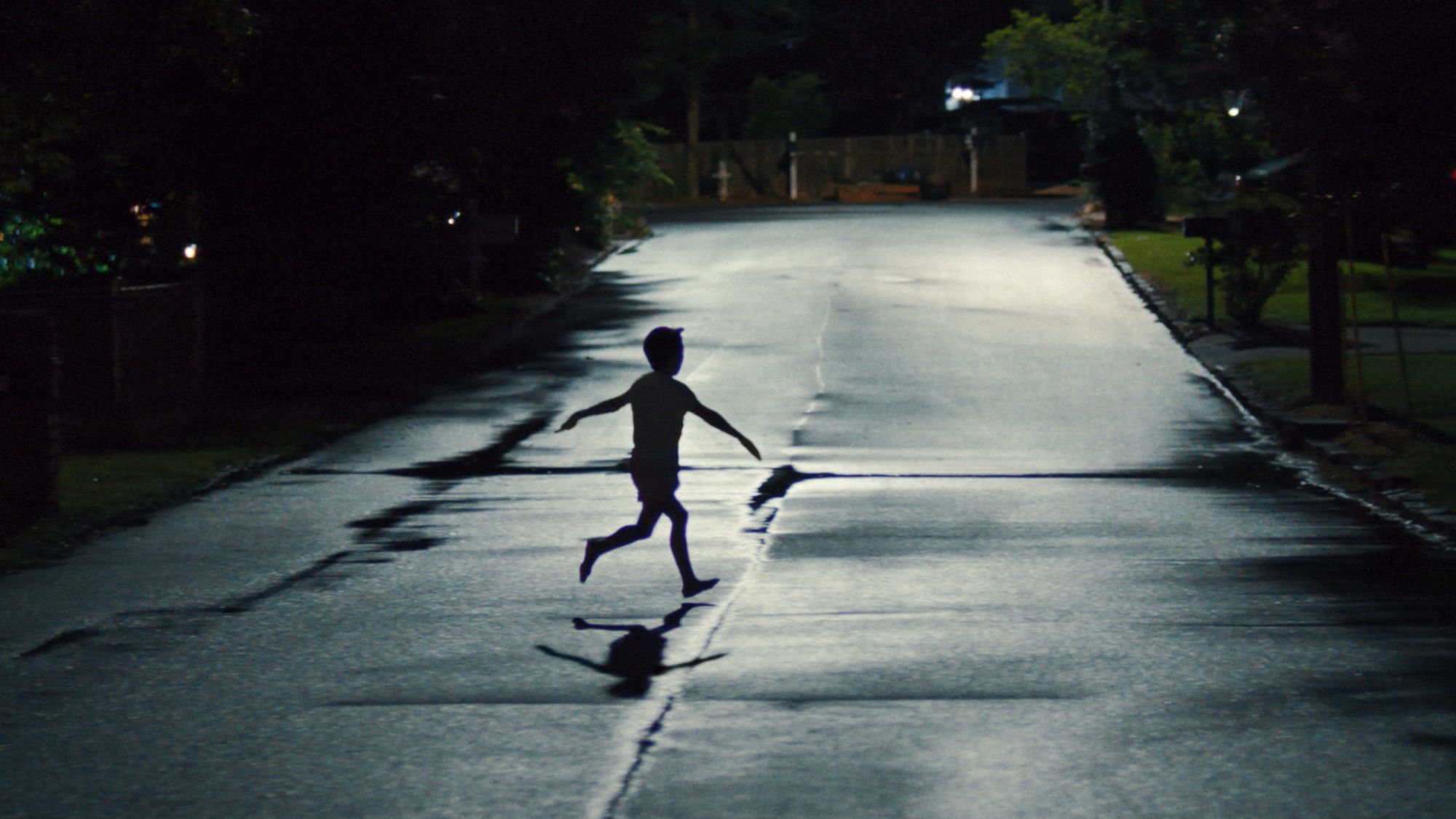 Child running on the street at night in Weapons