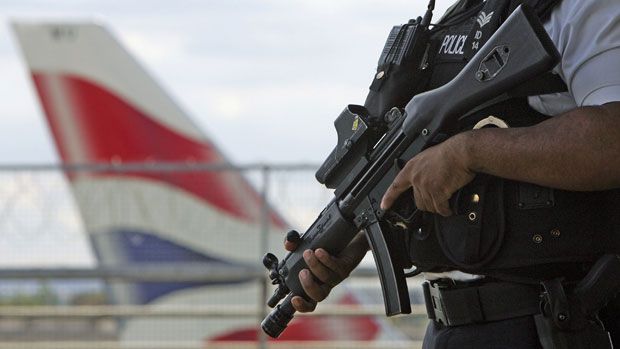 An armed officer patrols Heathrow Airport