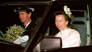 Commander Tim Laurence (L) and Britain's Princess Anne are seen in their car after their wedding at Crathie Church 12 December 1992 in Scotland.