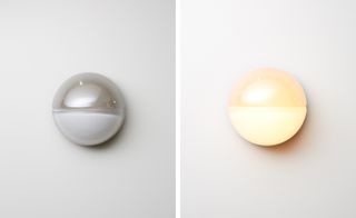 'Phase' – a cast glass spherical sconce, half-covered by chrome – mimics the Moon half-lit. Wall-mounted, the design can be installed with the exposed half facing upwards for a brighter effect, or downwards for added drama