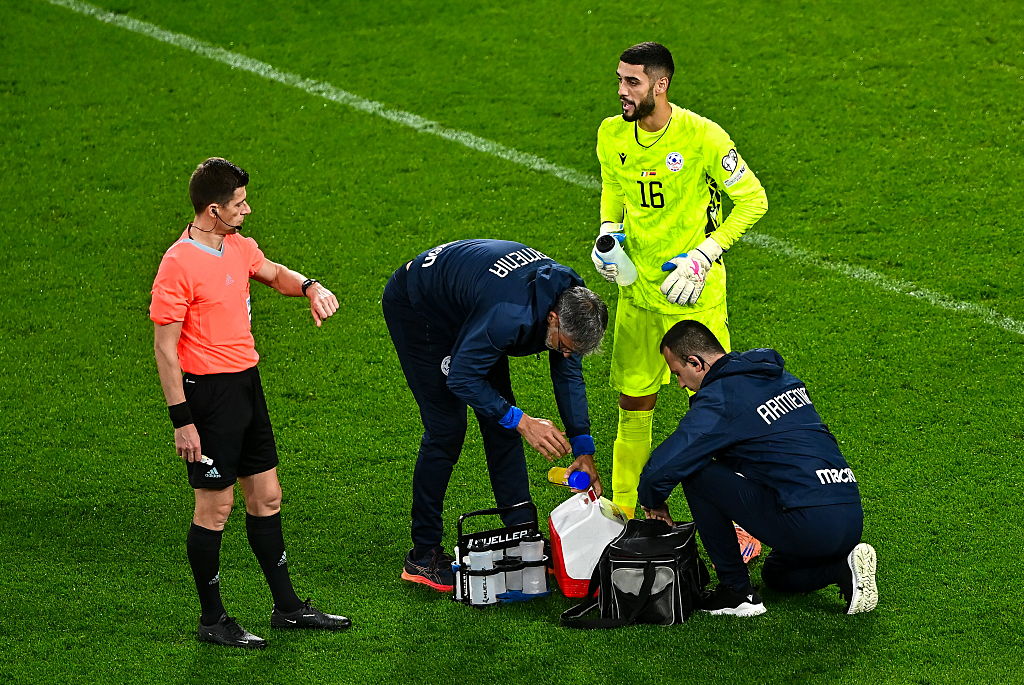 Dublin , Ireland - 14 October 2025; Armenia goalkeeper Henri Avagyan recieves medical attention as referee Beno&amp;icirc;t Bastien checks the time on his watch during the FIFA World Cup 2026 Group F qualifying match between Republic of Ireland and Armenia at the Aviva Stadium in Dublin. (Photo By Piaras &amp;Oacute; M&amp;iacute;dheach/Sportsfile via Getty Images)