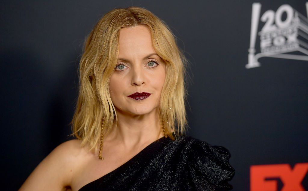 Mena Suvari&#039;s face against a black background