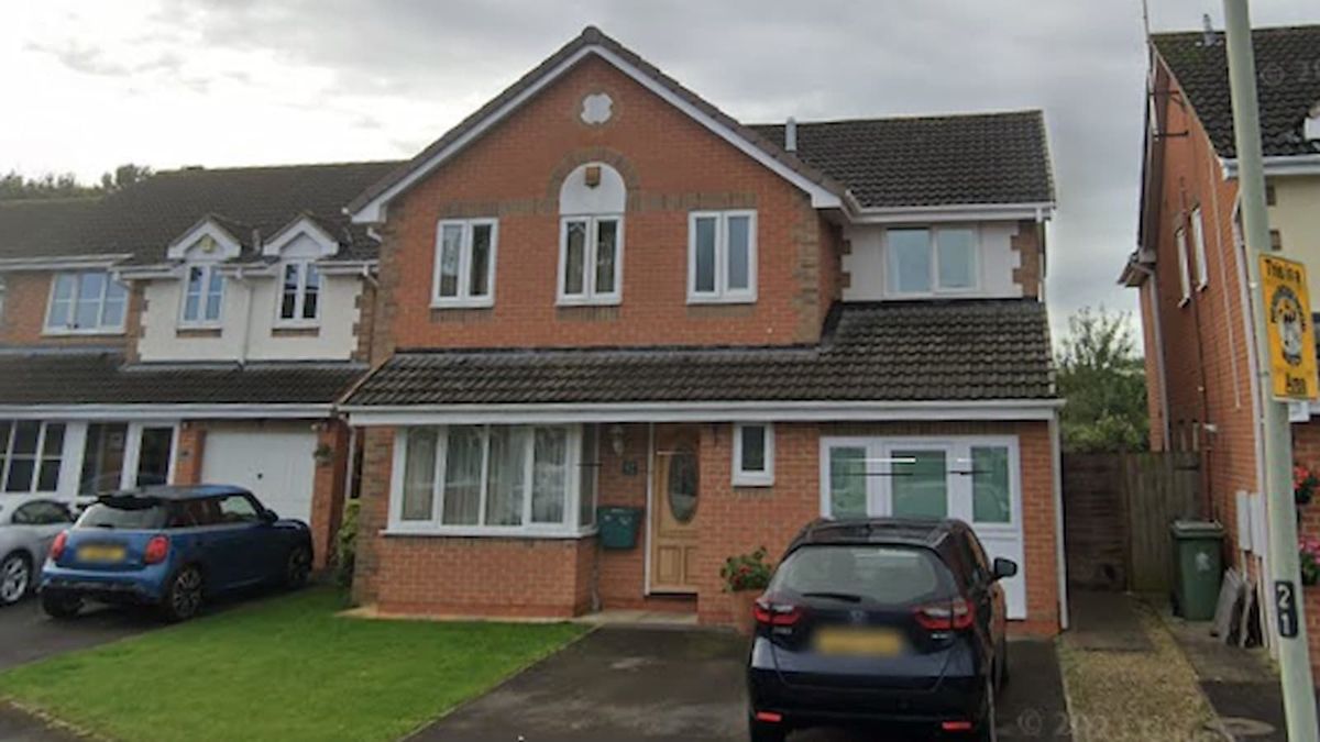 A brick house with a converted garage