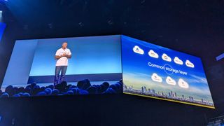 Dell's Jeff Clarke on a screen, next to another screen showing a cloud diagram