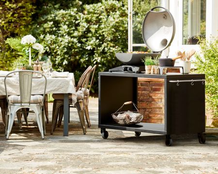 Outdoor cooking station on portable trolley.