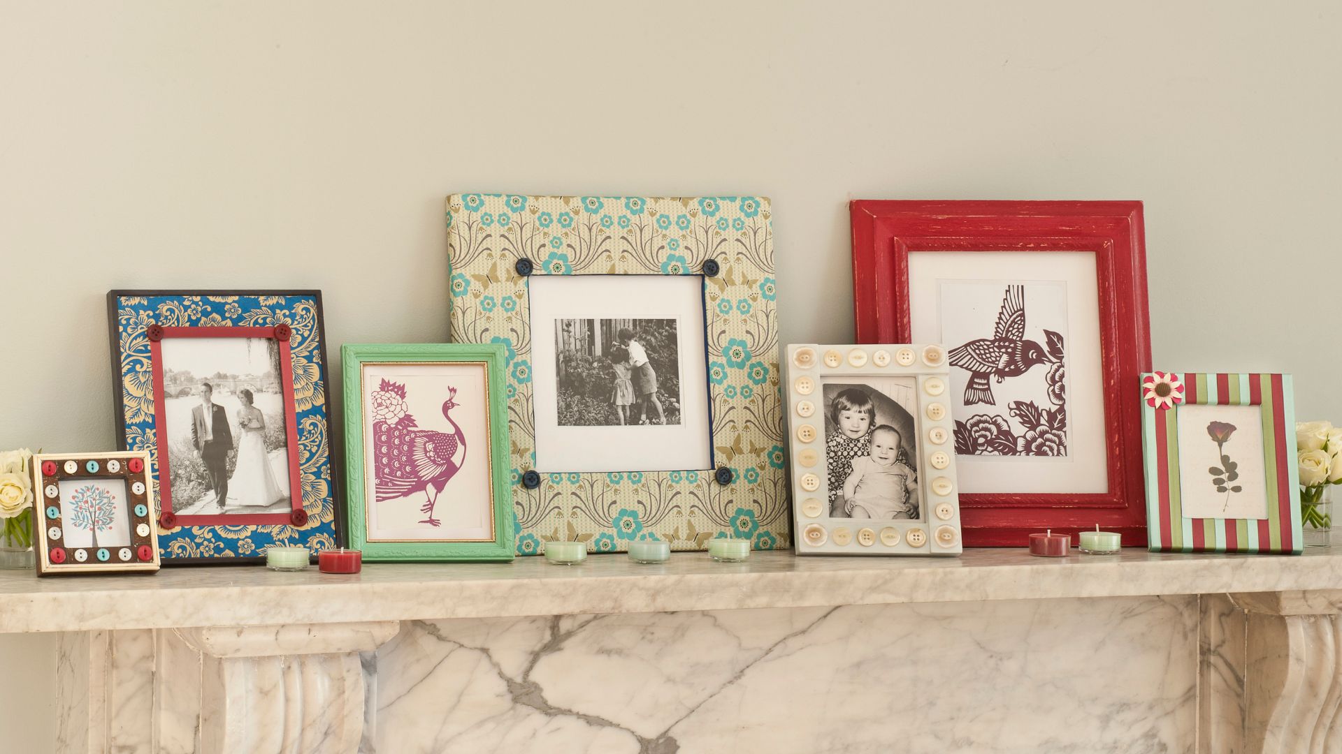 picture of a variety of frames and photographs placed on top of mantelpiece
