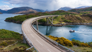 Kylesku Bridge on the North Coast 500 scenic driving route in Sutherland, Highland, northern Scotland.