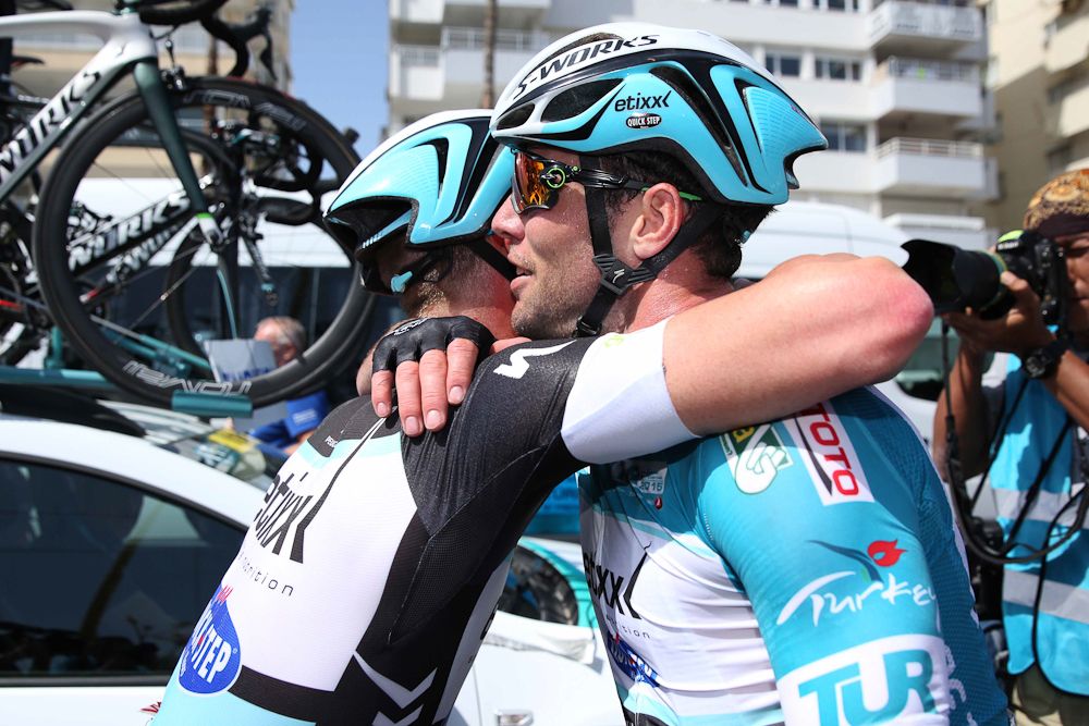Mark Cavendish is congratulated by a teammate after the stage.