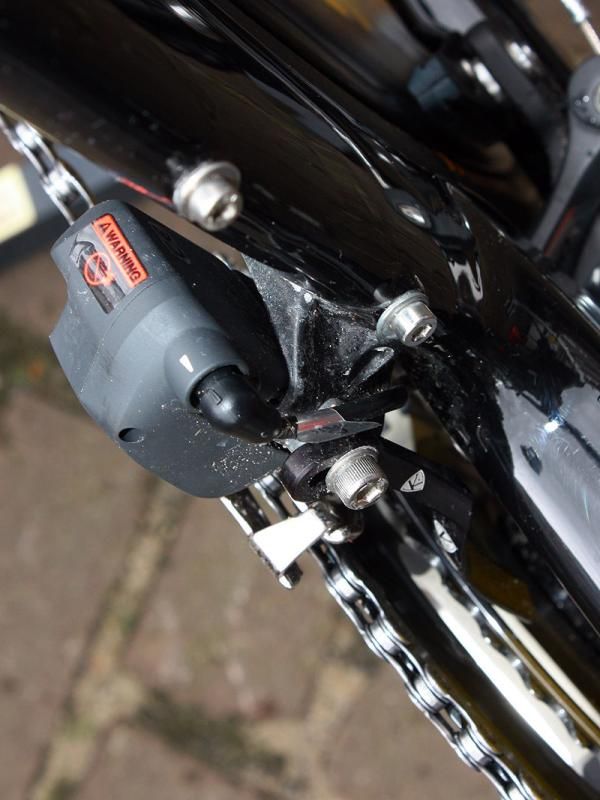 The Shimano Dura-Ace Di2 front derailleur mounts to a burly carbon bracket on the Scott Plasma 3 frame.