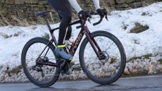 Cervelo Caledonia-5 being ridden up a snowy lane by a male rider wearing Sidi Nix boots