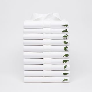Stack of white polo shirts with different animal logos