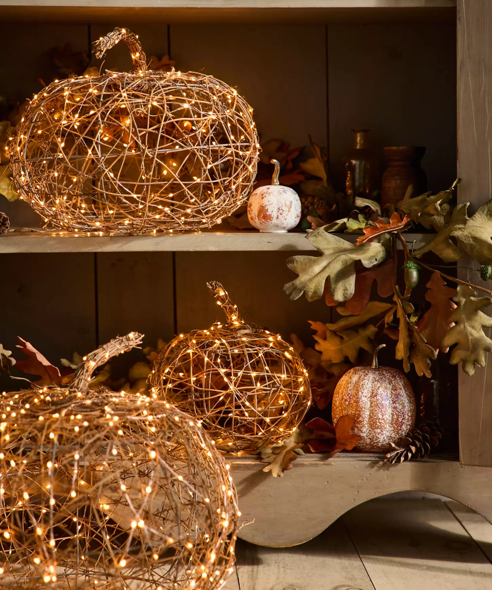 Halloween pumpkins made with woven rattan and string lights
