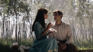 Tita and Pedro sitting together in a forest in Like Water For Chocolate