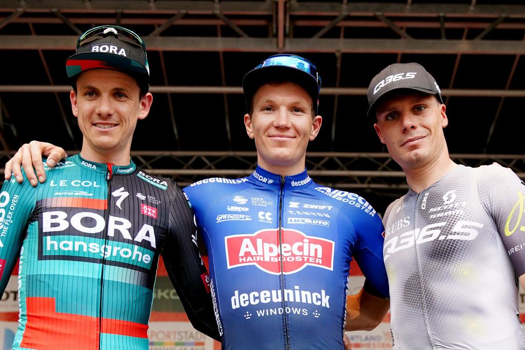 FRANKFURT GERMANY MAY 01 LR Patrick Konrad of Austria and Team BoraHansgrohe on second place race winner Sren Kragh Andersen of Denmark and Team AlpecinDeceuninck and Alessandro Fedeli of Italy and Q365 Pro Cycling Team on third place pose on the podium ceremony after the 62nd EschbornFrankfurt 2023 a 2038km one day race from Eschborn to Frankfurt UCIWT on May 01 2023 in Frankfurt am Main Germany Photo by Christian KasparBartkeGetty Images