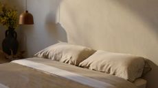 A minimalist bedroom with driftwood colored bamboo bedding