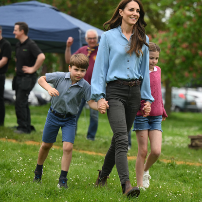 Prince Louis of Wales and Princess Charlotte of Wales walk with their mother, Catherine, Princess of Wales while taking part in the Big Help Out, during a visit to the 3rd Upton Scouts Hut in Slough on May 8, 2023 in London, England. The Big Help Out is a day when people are encouraged to volunteer in their communities. It is part of the celebrations of the Coronation of Charles III and his wife, Camilla, as King and Queen of the United Kingdom of Great Britain and Northern Ireland, and the other Commonwealth realms that took place at Westminster Abbey on Saturday, May 6, 2023.