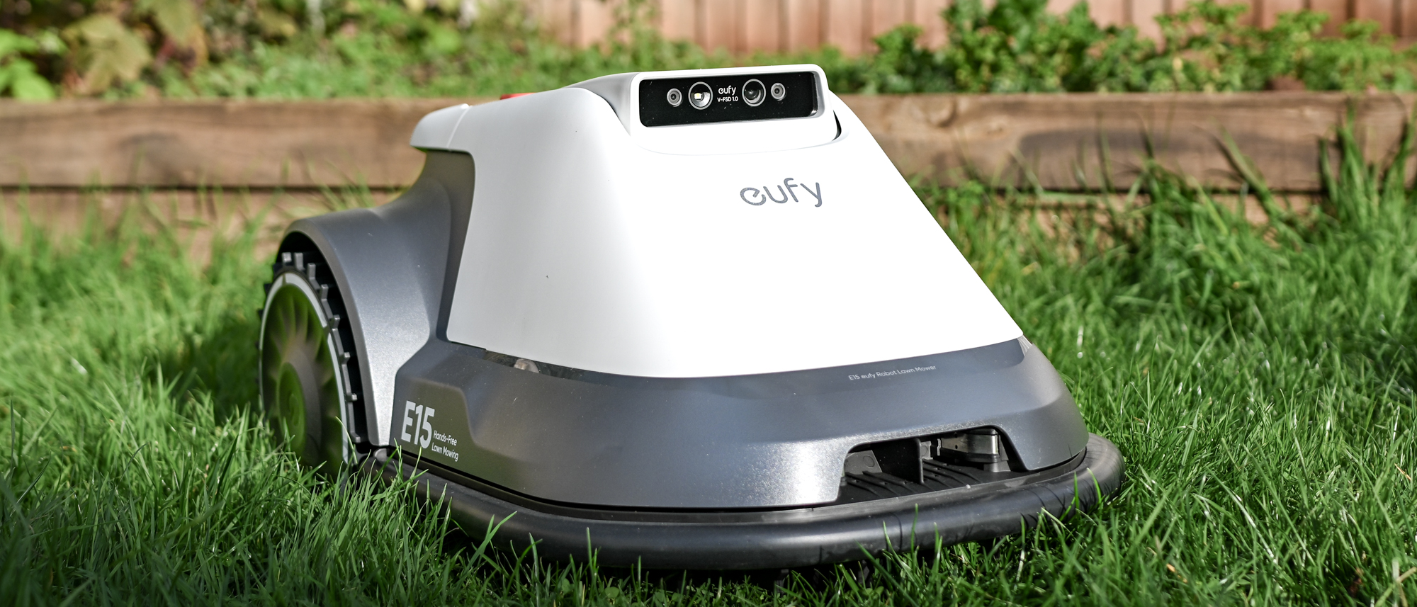 The Eufy E15 robot lawnmower in use on a lawn