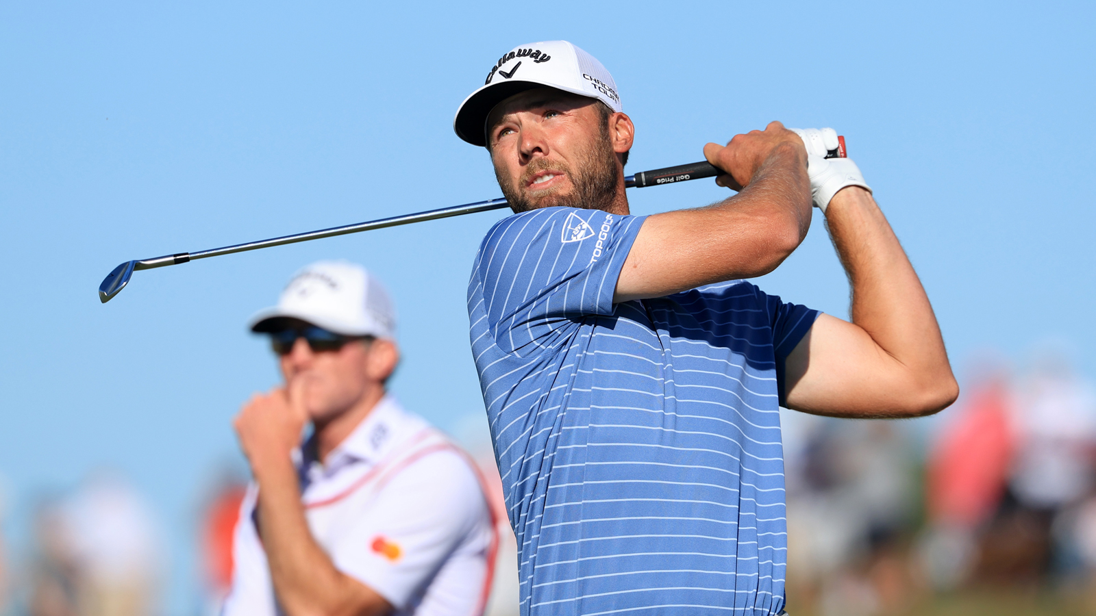 Sam Burns hits a wedge shot