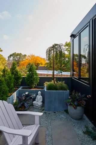 Garden at House 1909 by Studio Dwell, a metal-clad house in Chicago