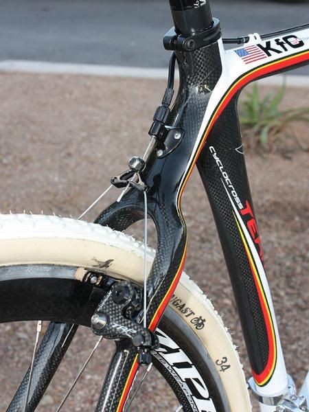 The stout-looking seat stay wishbone features a similarly stout-looking brake housing stop with an integrated barrel adjuster.