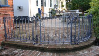 period style wrought iron gate and fence