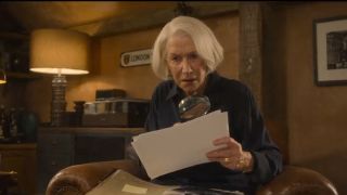 Helen Mirren looking at a clue in The Thursday Murder Club. 