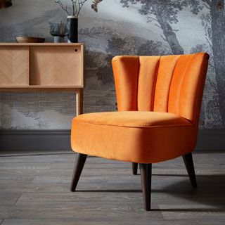 grey room with orange chair