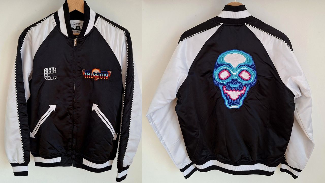 Back and front view of Kumagumi Truxton bomber jacket with skull embroidery on back.