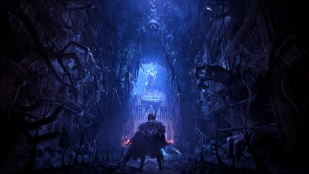 Lords of the Fallen screenshot showing a man standing in the middle of a dimly lit corridor surrounded by Eldritch-esque horros including long fingers and gazing eyes