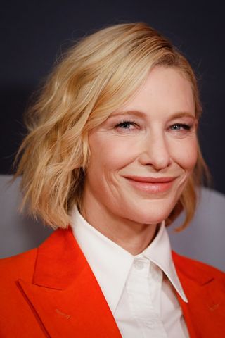 Cate Blanchett is pictured with a wavy, layered bob and poses at a special screening for TÁR at Cremorne Orpheum on November 13, 2022 in Sydney, Australia.