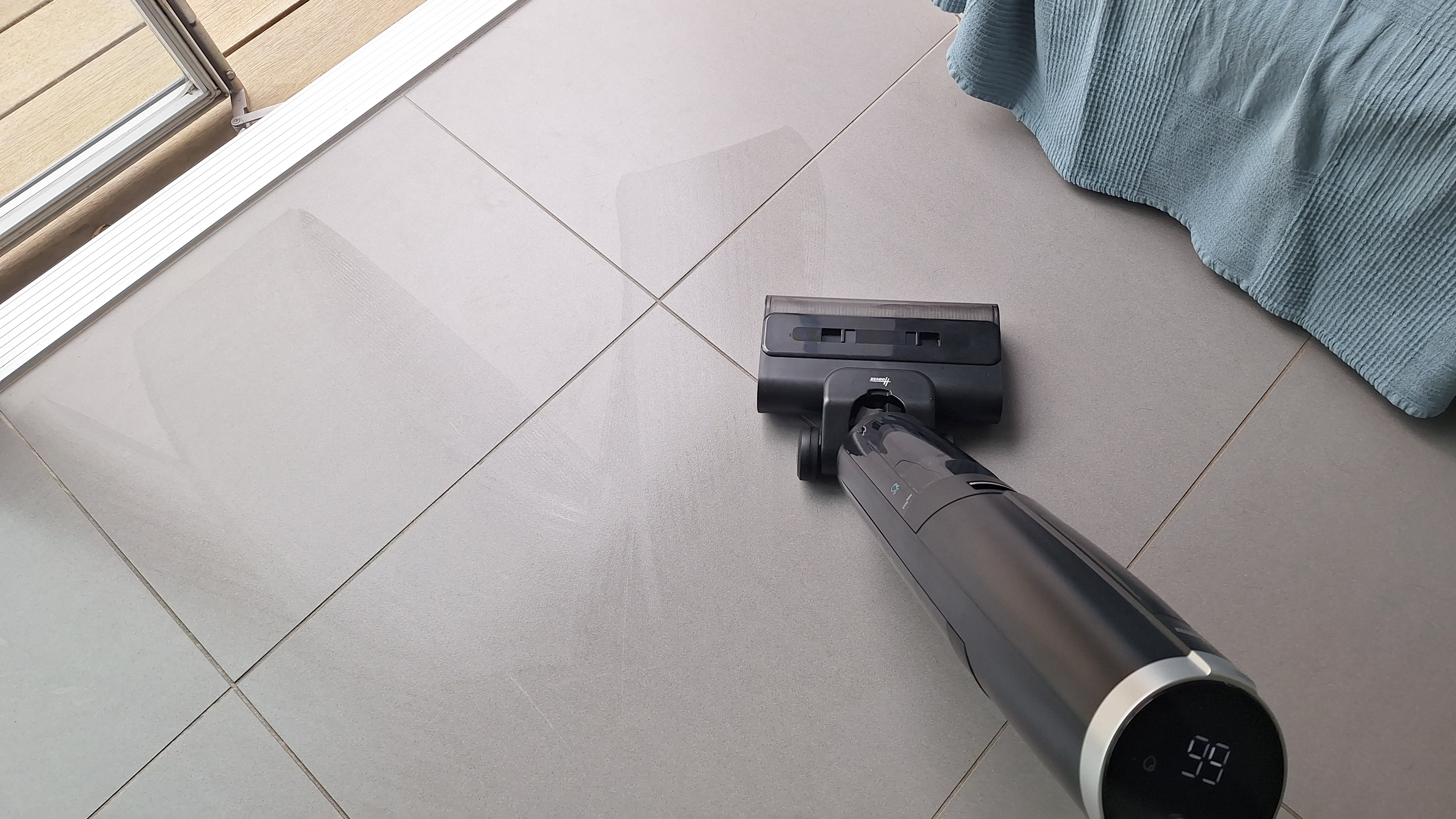 Hoover HW3 cleaning a tiled floor in reviewer&#039;s kitchen