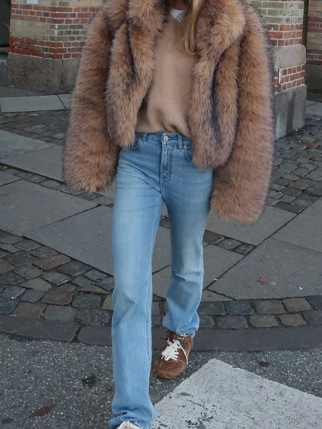 @_jeanettemadsen_ wearng a jumper, jeans and faux fur jacket