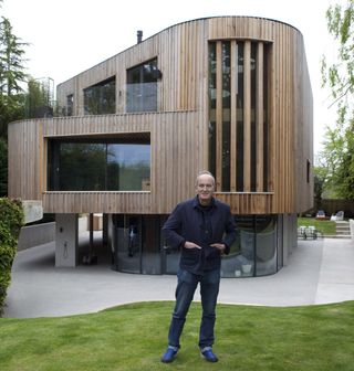 Kevin McCloud stands outside one of the Grand Designs in his next series