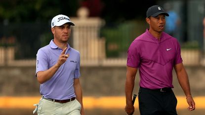 Justin Thomas and Tiger Woods pictured walking together