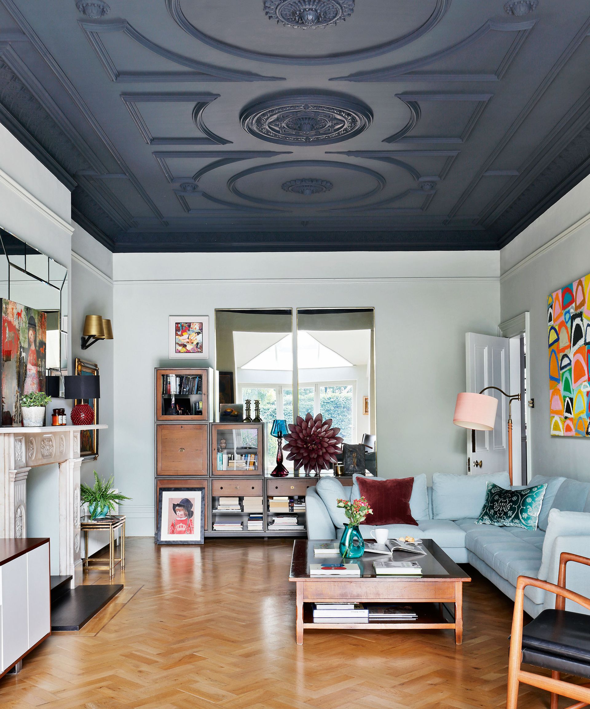 Living room accent wall with blue painted ceiling