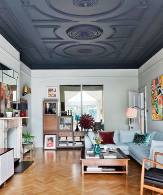 Living room accent wall with blue painted ceiling