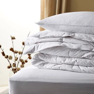 Marks & Spencer Duck Feather and Down duvet folded up on a bed